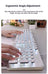 Ergonomic keyboard with hands typing on a desk with flowers and a camera in the background
